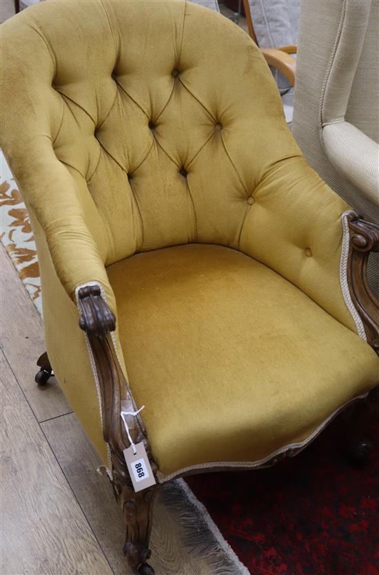 A green Victorian walnut buttoned spoon back armchair